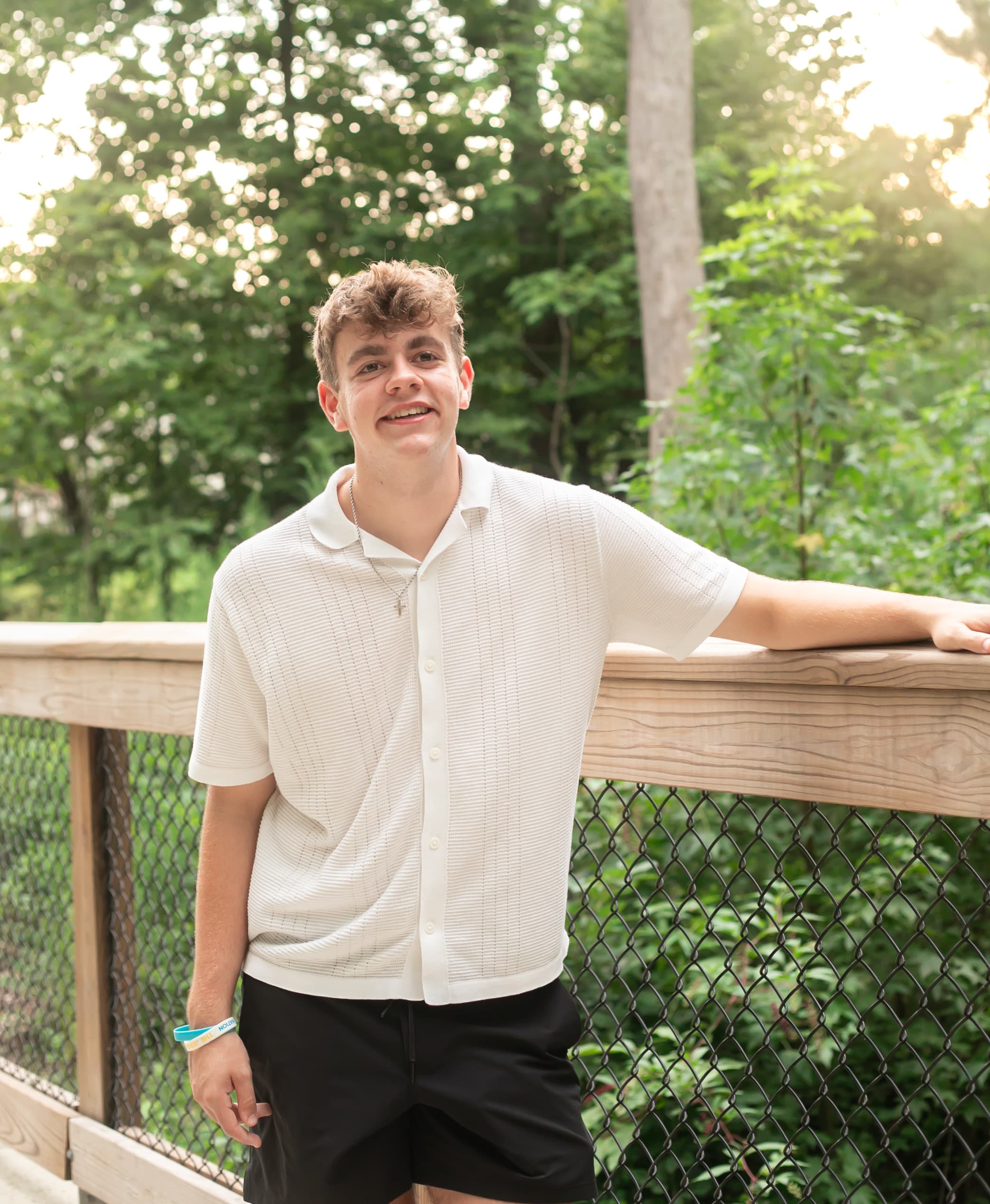 High school senior portrait on a bridge overlook
